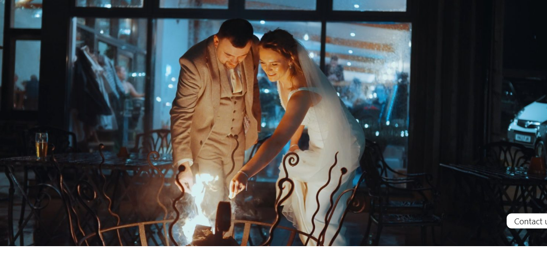 couples standing near the fireplace and having a post-wedding shoot